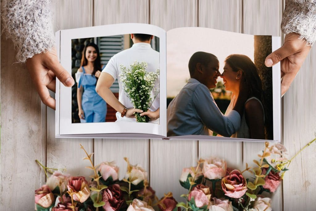 Wedding couple looking at a digital album